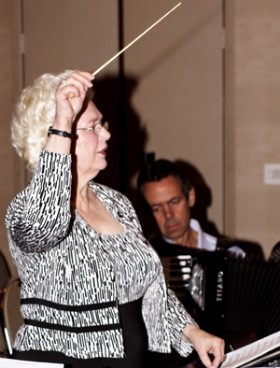 Joan C. Sommers conducting the ATG Executive and Friends Orchestra