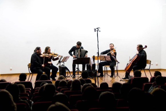 Accordionist João Gentil performs in concert with a string quartet