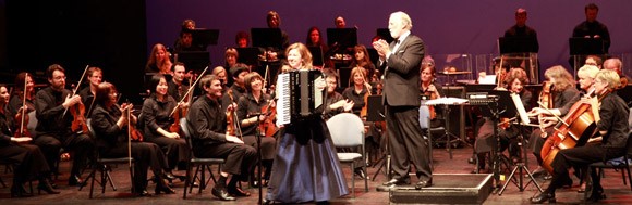 Auckland Symphony Orchestra with Gary Daverne Gary Daverne conducting and the  solo accordionist is Stephanie Poole